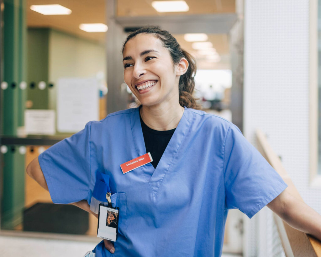 Symmetry CRNA smiling at healthcare facility